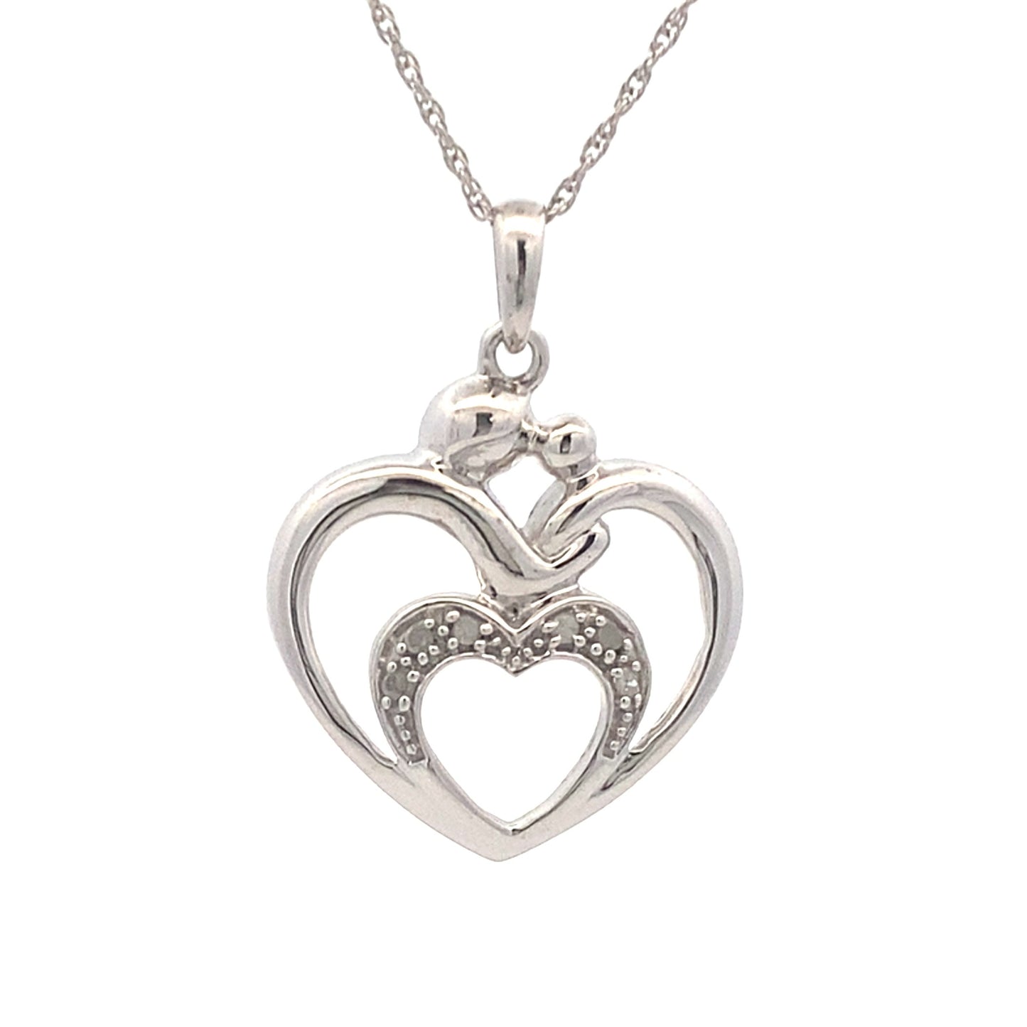 Colgante de corazón de diamantes de .10 ct y plata de ley