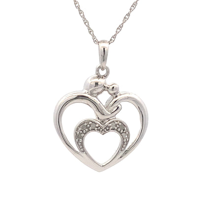 Colgante de corazón de diamantes de .10 ct y plata de ley
