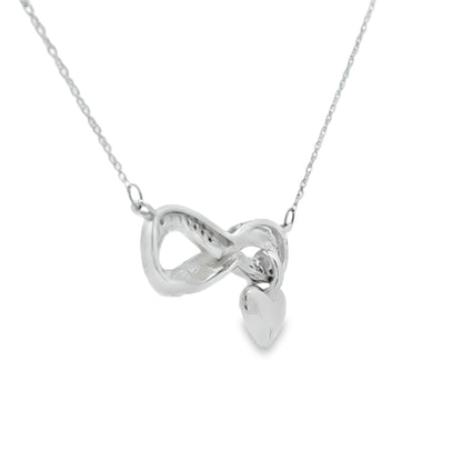 Colgante religioso de cruz con diamante de .04ct de plata de ley