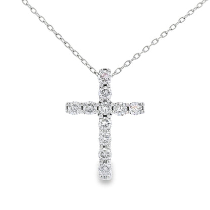 Colgante religioso de cruz con diamante de .35ct en oro blanco de 14K