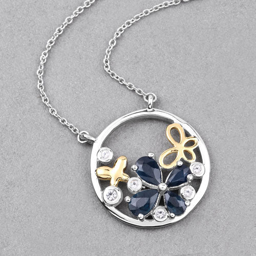 Colgante de plata de ley .925 con zafiro azul genuino de 1.41 quilates y topacio blanco