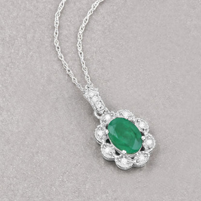Colgante de oro blanco de 10K con esmeralda genuina de Zambia de 0,79 quilates y diamantes blancos