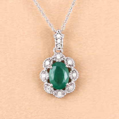 Colgante de oro blanco de 10K con esmeralda genuina de Zambia de 0,79 quilates y diamantes blancos