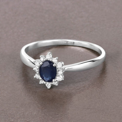 Anillo de oro blanco de 14K con zafiro azul auténtico de 0,44 quilates y diamantes blancos