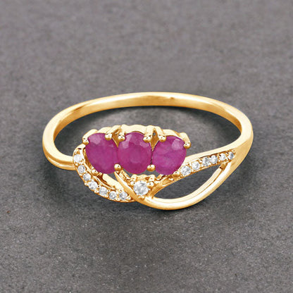 Anillo de oro amarillo de 14K con rubí genuino de 0.71 quilates y diamantes blancos