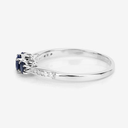 Anillo de oro blanco de 14K con zafiro azul genuino de 0,56 quilates y diamantes blancos