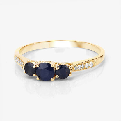 Anillo de oro amarillo de 14K con zafiro azul genuino de 0,56 quilates y diamantes blancos