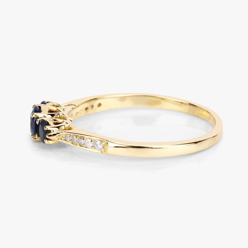 Anillo de oro amarillo de 14K con zafiro azul genuino de 0,56 quilates y diamantes blancos
