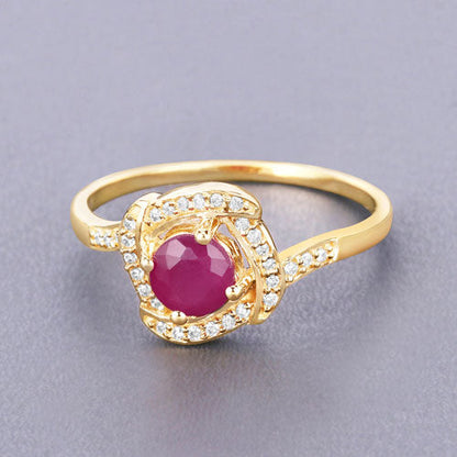 Anillo de oro amarillo de 14K con rubí genuino de 0,63 quilates y diamantes blancos
