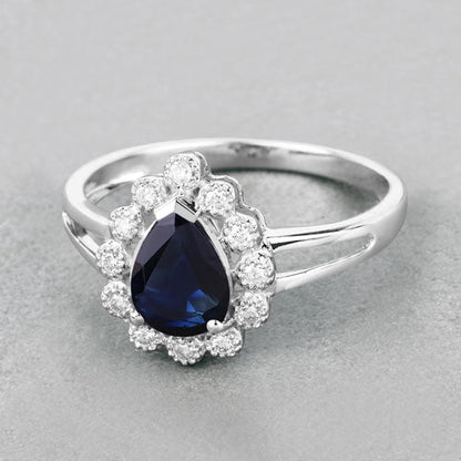 Anillo de oro blanco de 10 quilates con zafiro azul genuino de 1,46 quilates y diamantes blancos