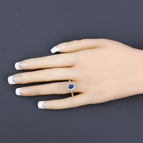Anillo de oro amarillo de 10K con zafiro azul genuino de 1.11 quilates y diamante blanco