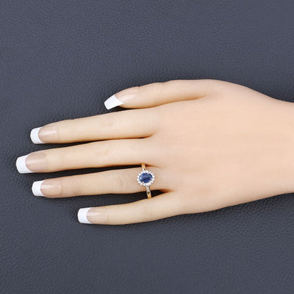 Anillo de oro amarillo de 10K con zafiro azul genuino de 1.11 quilates y diamante blanco