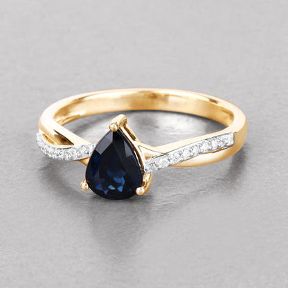 Anillo de oro amarillo de 14K con zafiro azul auténtico de 1.17 quilates y diamantes blancos